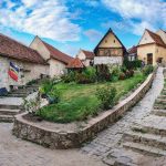 Rasnov Fortress with beautiful medieval stone houses on the main street, Brasov county, Romania. Panoramic view